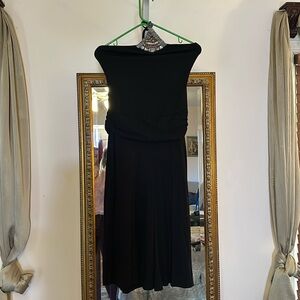 Black halter Goucho jumpsuit.  Has beads and decals at top of chest area